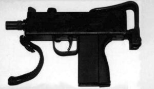 Cops find sub-machine gun in abandoned building - Jamaica Observer