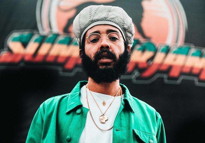 Shocking! Protoje removes his hat, poses in bathrobe Jamaica Observer
