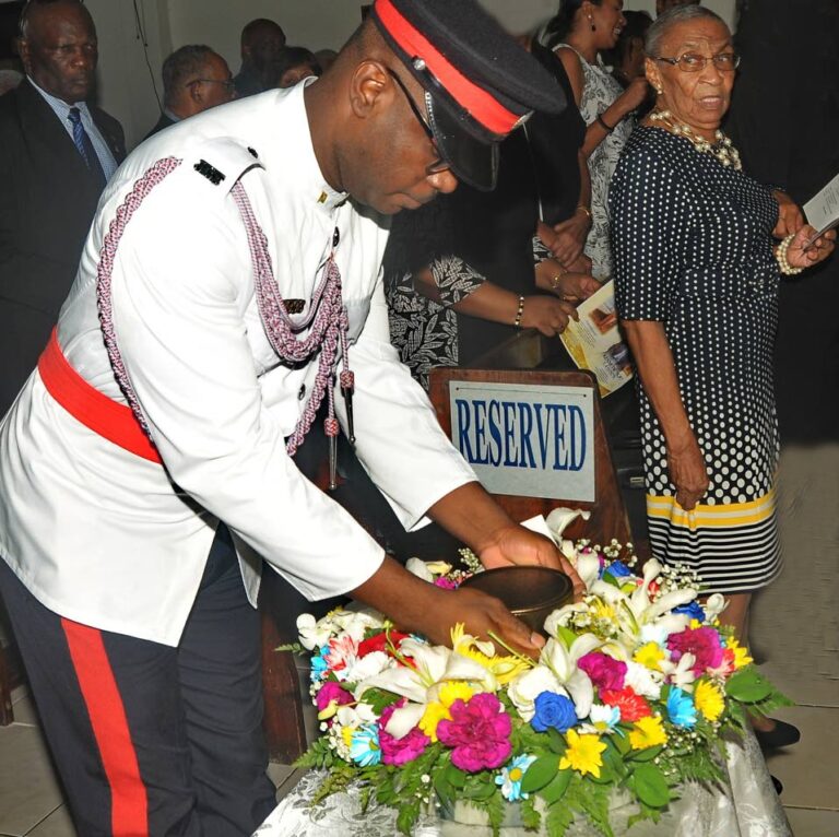‘KP’ Lawson eulogised as affectionate family man, revered cop(00)