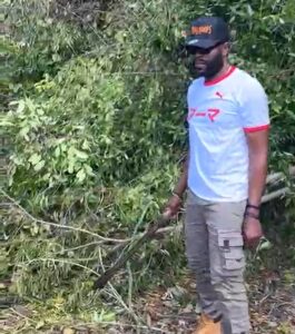 Bolt’s manager helps to clear road, assesses hurricane damage in legend’s hometown