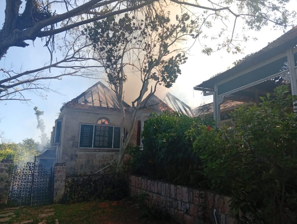 Fire of unknown origin extensively damaged sections of Outameni Experience building in Trelawny