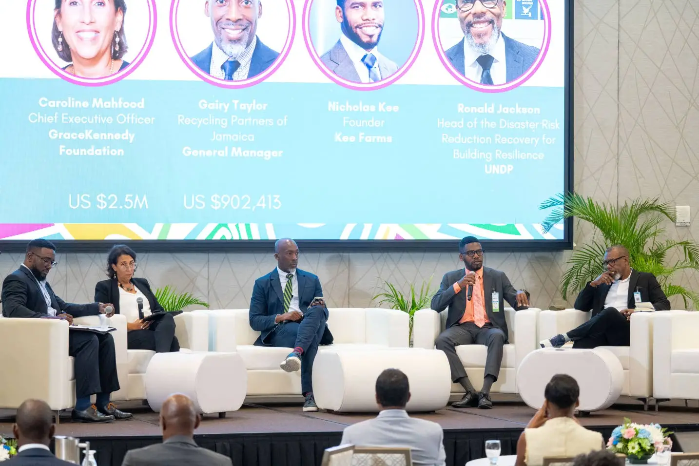 Gerald Lindo (left), director of the Caribbean chapter of the Glasgow Financial Alliance for Net Zero, moderates a discussion on climate finance and investment opportunities featuring Caroline Mahfood of GraceKennedy Foundation; general manager of the Recycling Partners of Jamaica, Gairy Taylor; Nicholas Kee of Kee Farms; and head of Disaster Risk Reduction Recovery for Building Resilience at the UNDP, Ronald Jackson. .