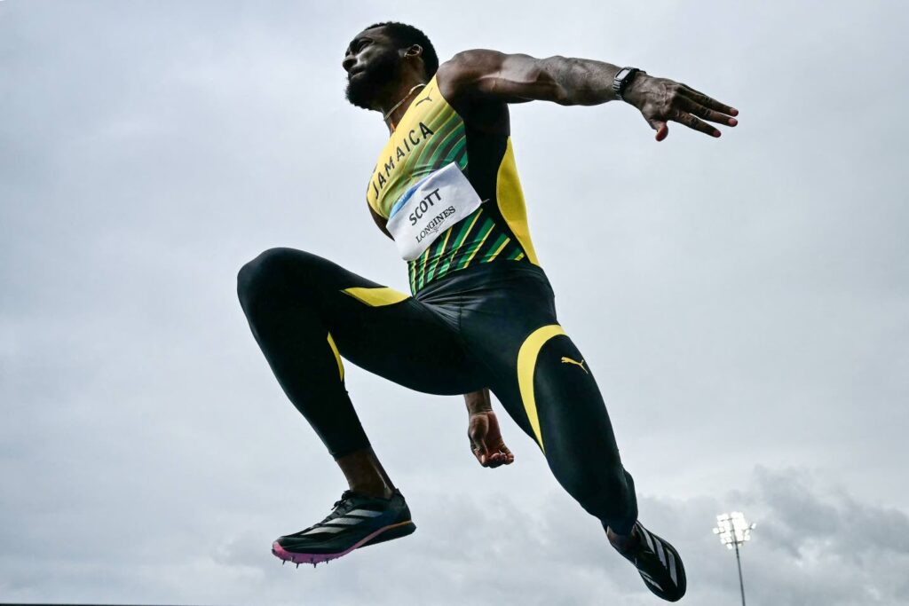 Scott delivers historic triple jump gold