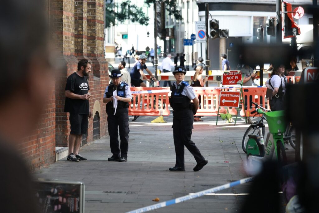 Woman arrested as four men stabbed in central London